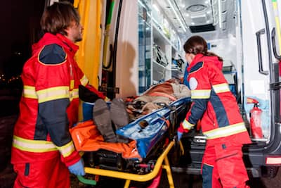 A person with Serious Injuries is put into an ambulance, Florida Personal Injury Attorney Rosenberg Law Firm